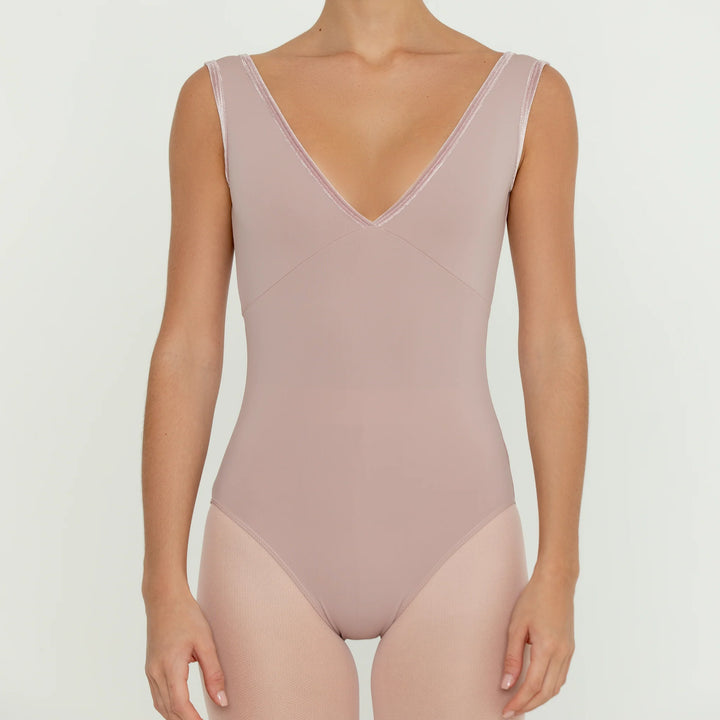 A pink ballet leotard with a deep V-back and velvet trim around the neckline.