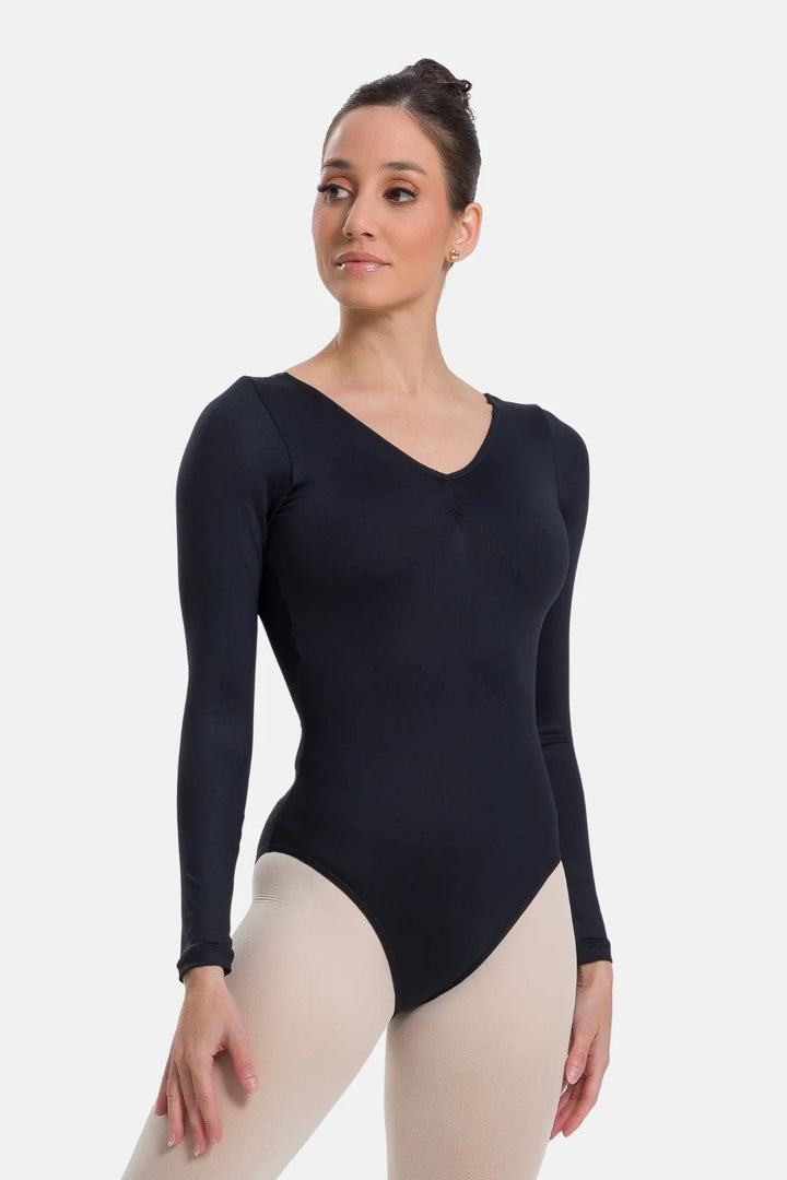Woman wearing a black long-sleeve leotard on a white background