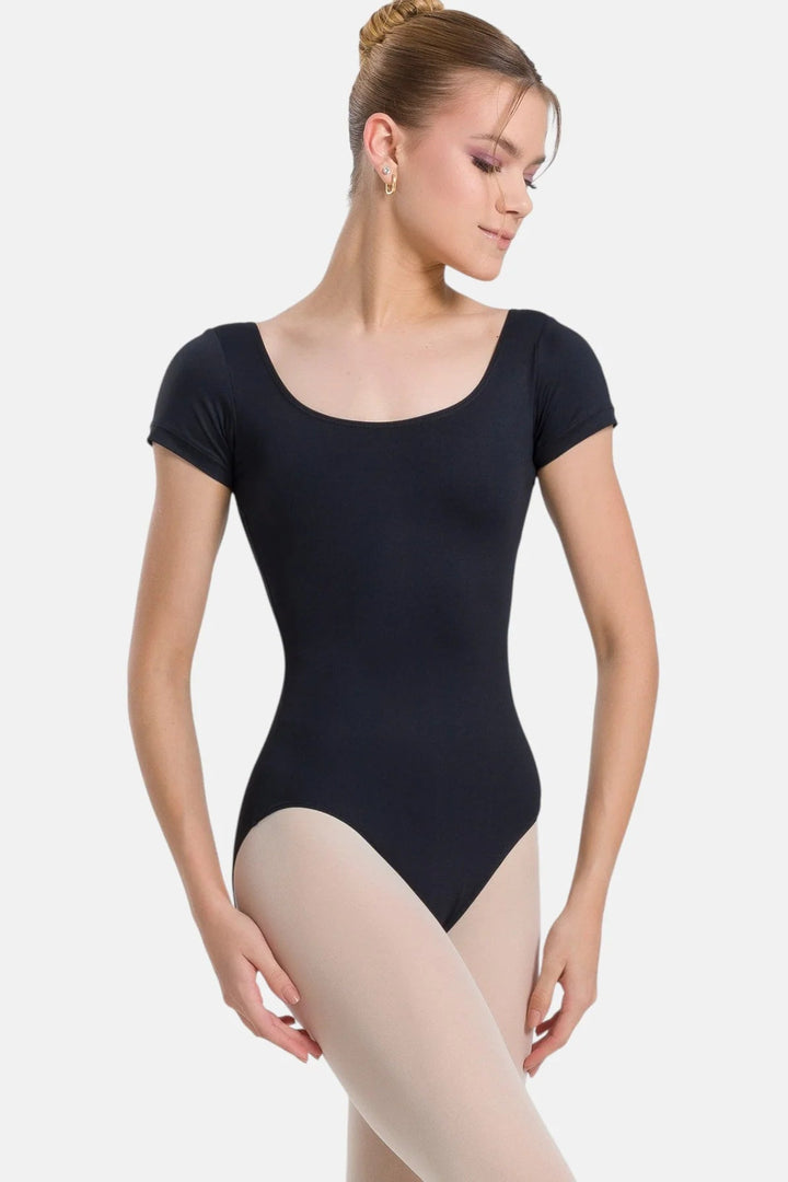 Woman wearing a black leotard on a white background