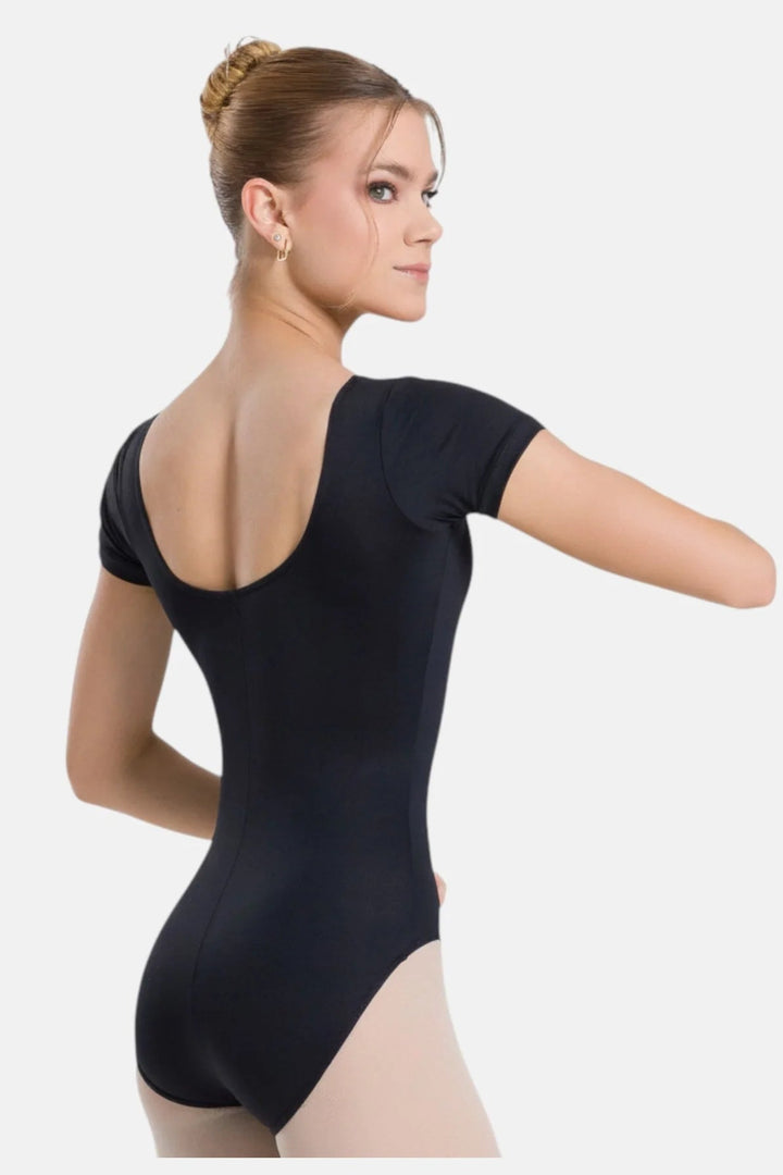 Woman wearing a black leotard on a white background