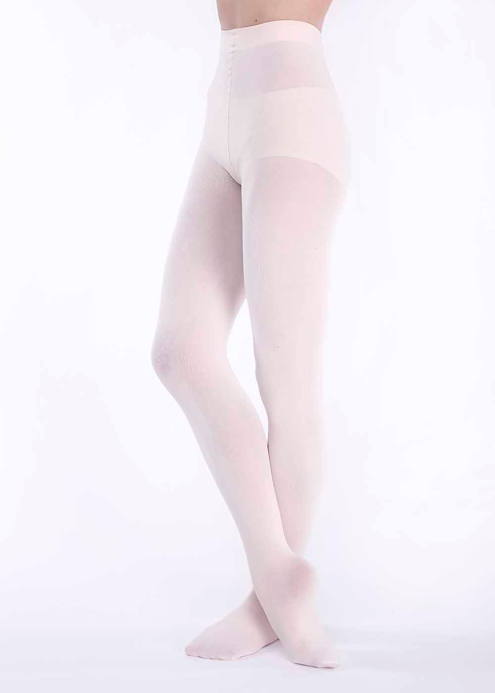 A pair of beige footed tights for girls, made from a nylon and spandex blend, displayed on a model.